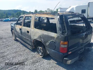 2002 Chevrolet Suburban LT z VIN 1GNFK16Z82J207479, wystawiony jako IAAI lot #42668056 z przebiegiem 140 000 mil mil oraz . Historia ofert i sprzedaży dostępna na DreamBid. Obrazek 3.