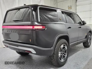 2023 Rivian R1S Launch Edition with VIN 7PDSGABL2PN020404, listed as a Copart auction lot 81428984 with 128 mi miles and Clean Title. Bid and sale history available at carsss.com. Image 4.