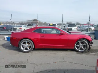 2014 Chevrolet Camaro LT z VIN 2G1FC1E31E9291298, wystawiony jako IAAI lot #41405239 z przebiegiem 122 688 mil mil oraz . Historia ofert i sprzedaży dostępna na DreamBid. Obrazek 13.