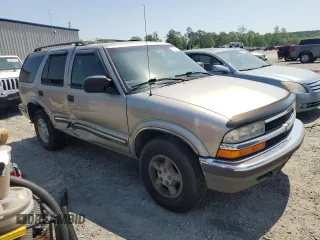 1999 Chevrolet Blazer Trailblazer z VIN 1GNDT13W1X2169254, wystawiony jako Copart lot #55021105 z przebiegiem 158 169 mil mil oraz Szkody całkowita. Historia ofert i sprzedaży dostępna na DreamBid. Obrazek 4.
