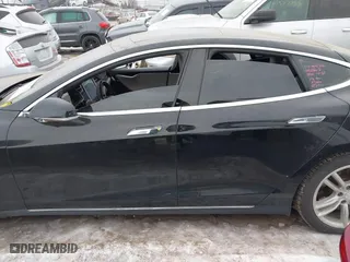 2015 Tesla Model S 85D with VIN 5YJSA1E25FF107819, listed as a IAAI auction lot 41333556 with 141,066 mi miles. Bid and sale history available at carsss.com. Image 14.