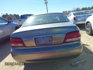 1999 Mazda 626 LX with VIN 1YVGF22D8X5871485, listed as a IAAI auction lot 41641049 with 115,603 mi miles. Bid and sale history available at carsss.com. Image 16.
