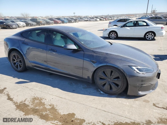 2023 Tesla Model S with VIN 5YJSA1E5XPF516118, listed as a Copart auction lot 42147345 with 12,564 mi miles and Salvage Title. Bid and sale history available at carsss.com. Image 4.