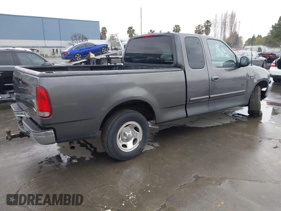 2003 Ford F-150 XL with VIN 1FTRX17W03NB51687, listed as a IAAI auction lot 41712022 with 183,428 mi miles. Bid and sale history available at carsss.com. Image 4.