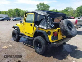 2005 Jeep Wrangler Sport z VIN 1J4FA49S65P381798, wystawiony jako IAAI lot #42305109 z przebiegiem 71 880 mil mil oraz . Historia ofert i sprzedaży dostępna na DreamBid. Obrazek 3.