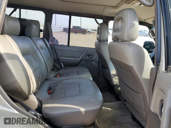 1998 Mitsubishi Montero z VIN JA4MR51R0WJ000921, wystawiony jako Copart lot #56250965 z przebiegiem 181 293 mil mil oraz Szkoda całkowita • Salvage title. Historia ofert i sprzedaży dostępna na DreamBid. Obrazek 11.