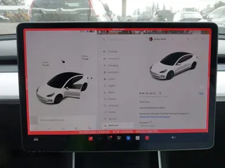 2020 Tesla Model 3 Standard Range Plus with VIN 5YJ3E1EA5LF613002, listed as a IAAI auction lot 42129085 with 55,672 mi miles. Bid and sale history available at carsss.com. Image 19.