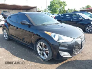 2014 Hyundai Veloster z VIN KMHTC6AD4EU185738, wystawiony jako IAAI lot #42366076 z przebiegiem 128 309 mil mil oraz . Historia ofert i sprzedaży dostępna na DreamBid. Obrazek 1.