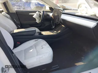 2022 Tesla Model 3 with VIN 5YJ3E1EA4NF319237, listed as a IAAI auction lot 41263761 with 44,384 mi miles and . Bid and sale history available at DreamBid. Image 5.