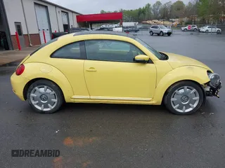 2012 Volkswagen Beetle 2.5L w/Sound/Nav PZEV with VIN 3VWJP7AT4CM613867, listed as a IAAI auction lot 41602806 with 167,004 mi miles. Bid and sale history available at carsss.com. Image 13.