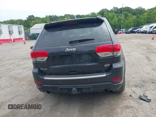 2015 Jeep Grand Cherokee Overland z VIN 1C4RJFCG3FC753772, wystawiony jako IAAI lot #42357411 z przebiegiem 130 970 mil mil oraz . Historia ofert i sprzedaży dostępna na DreamBid. Obrazek 16.