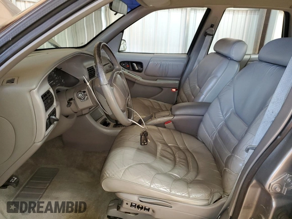 1996 Buick Regal Custom with VIN 2G4WB52KXT1523059, listed as a Copart auction lot 88440285 with 95,444 mi miles and Salvage title. Bid and sale history available at DreamBid. Image 7.