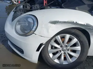2016 Volkswagen Beetle Coupe 1.8T Wolfsburg Edition with VIN 3VWF17AT0GM607755, listed as a IAAI auction lot 41508585 with 52,913 mi miles. Bid and sale history available at carsss.com. Image 6.