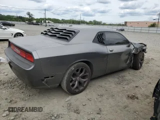 2011 Dodge Challenger z VIN 2B3CJ4DG5BH570472, wystawiony jako Copart lot #58479265 z przebiegiem Nie podano mil oraz Szkoda całkowita • Salvage title. Historia ofert i sprzedaży dostępna na DreamBid. Obrazek 3.