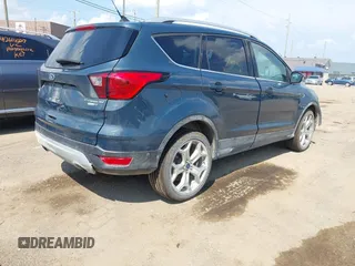2019 Ford Escape Titanium with VIN 1FMCU9J99KUC00935, listed as a IAAI auction lot 42583250 with 91,241 mi miles and . Bid and sale history available at DreamBid. Image 4.