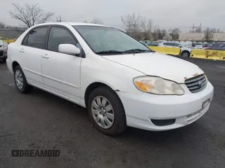 2004 Toyota Corolla CE with VIN 1NXBR32E34Z335238, listed as a IAAI auction lot 41987476 with 124,999 mi miles. Bid and sale history available at carsss.com. Image 1.