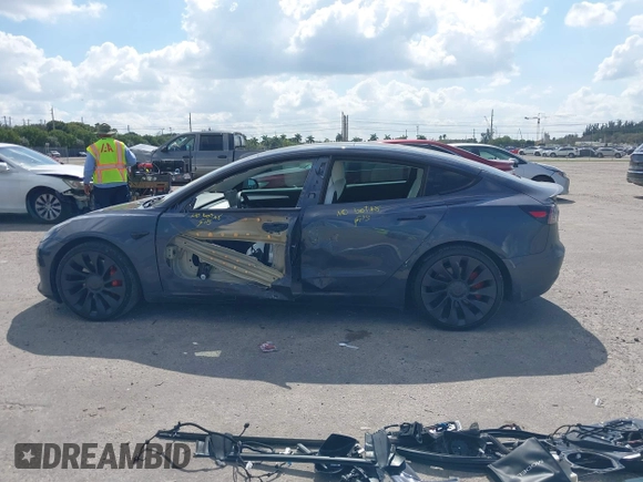 2022 Tesla Model 3 Performance with VIN 5YJ3E1EC9NF201184, listed as a IAAI auction lot 41534959 with 29,389 mi miles and . Bid and sale history available at DreamBid. Image 15.