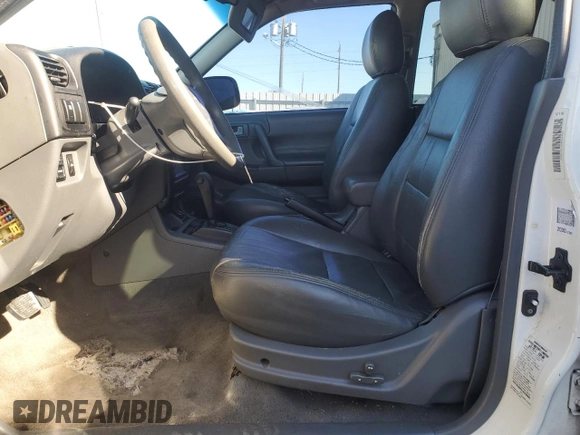 2001 Isuzu Rodeo S with VIN 4S2CK58W514310849, listed as a Copart auction lot 89221945 with 138,720 mi miles and Salvage title. Bid and sale history available at DreamBid. Image 7.