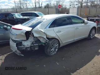 2014 Cadillac XTS Premium with VIN 2G61P5S38E9124277, listed as a IAAI auction lot 41744734 with 136,223 mi miles. Bid and sale history available at carsss.com. Image 4.