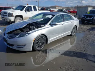 2014 Lincoln MKZ z VIN 3LN6L2J95ER830342, wystawiony jako IAAI lot #41876269 z przebiegiem 137 089 mil mil oraz . Historia ofert i sprzedaży dostępna na DreamBid. Obrazek 2.