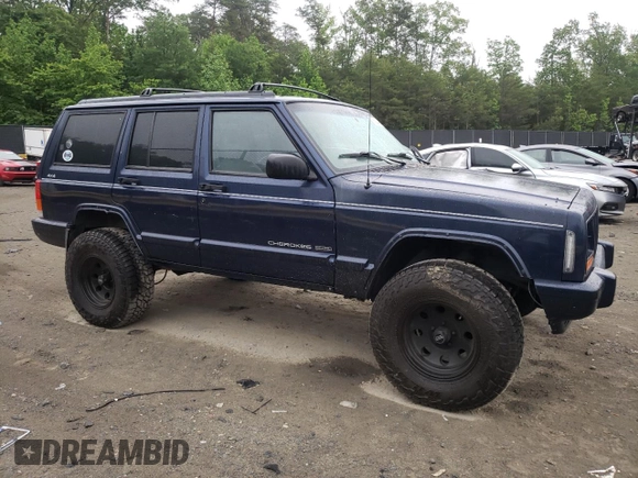 1997 Jeep Cherokee Country with VIN 1J4FJ78S4VL589852, listed as a Copart auction lot 56294015 with 189,530 mi miles and Salvage title. Bid and sale history available at DreamBid. Image 4.
