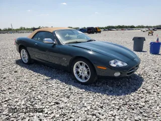 2002 Jaguar XK with VIN SAJDA42C62NA25816, listed as a Copart auction lot 52802525 with Not Provided miles and Salvage Title. Bid and sale history available at DreamBid. Image 4.