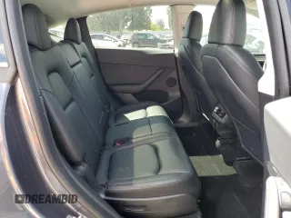 2023 Tesla Model Y Long Range z VIN 7SAYGAEE7PF714828, wystawiony jako Copart lot #89210485 z przebiegiem 42 256 mil mil oraz Szkoda całkowita • Salvage title. Historia ofert i sprzedaży dostępna na DreamBid. Obrazek 11.