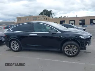 2017 Tesla Model X 90D with VIN 5YJXCAE2XHF075341, listed as a IAAI auction lot 41784008 with 77,439 mi miles and . Bid and sale history available at DreamBid. Image 14.