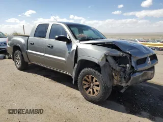 2008 Mitsubishi Raider LS z VIN 1Z7HT28KX8S620516, wystawiony jako Copart lot #76298034 z przebiegiem 185 938 mil mil oraz Szkoda całkowita • Salvage title. Historia ofert i sprzedaży dostępna na DreamBid. Obrazek 4.