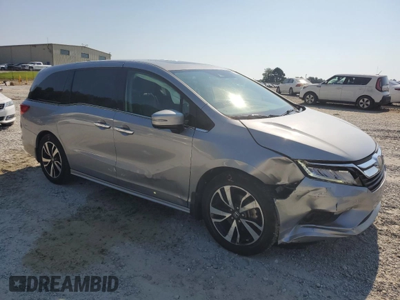 2018 Honda Odyssey Elite with VIN 5FNRL6H95JB062033, listed as a Copart auction lot 63732915 with 105,234 mi miles and Salvage title. Bid and sale history available at DreamBid. Image 4.