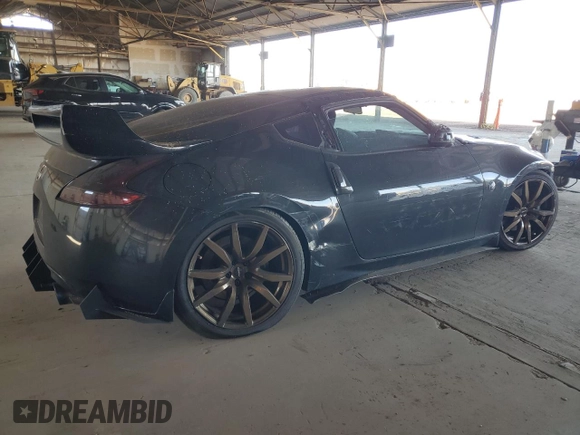 2009 Nissan 370Z z VIN JN1AZ44E19M411715, wystawiony jako Copart lot #56654815 z przebiegiem 123 791 mil mil oraz Szkoda całkowita • Salvage title. Historia ofert i sprzedaży dostępna na DreamBid. Obrazek 3.