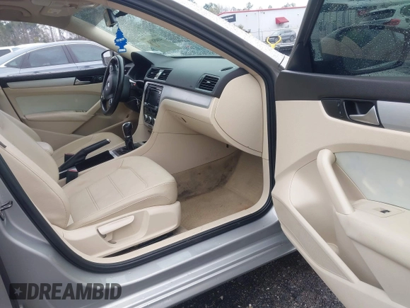 2012 Volkswagen Passat SE with VIN 1VWBH7A36CC077412, listed as a IAAI auction lot 41651796 with 113,259 mi miles and . Bid and sale history available at DreamBid. Image 5.