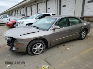2002 Oldsmobile Aurora z VIN 1G3GR64H224169066, wystawiony jako Copart lot #44636565 z przebiegiem 69 419 mil mil oraz Szkody całkowita. Historia ofert i sprzedaży dostępna na DreamBid. Obrazek 1.