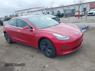 2018 Tesla Model 3 Long Range Battery with VIN 5YJ3E1EB3JF129772, listed as a IAAI auction lot 42017305 with 103,825 mi miles and . Bid and sale history available at DreamBid. Image 1.
