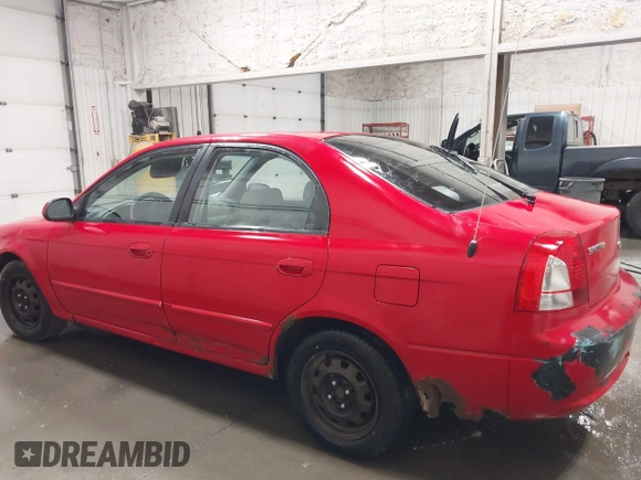 2003 Kia Spectra GS z VIN KNAFB161035115874, wystawiony jako IAAI lot #42179809 z przebiegiem 127 594 mil mil oraz . Historia ofert i sprzedaży dostępna na DreamBid. Obrazek 14.