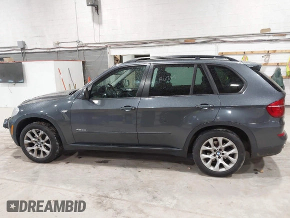 2012 BMW X5 35i z VIN 5UXZV4C59CL985715, wystawiony jako IAAI lot #42307586 z przebiegiem 105 147 mil mil oraz . Historia ofert i sprzedaży dostępna na DreamBid. Obrazek 14.