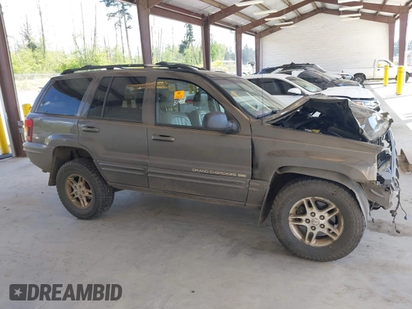 1999 Jeep Grand Cherokee Limited z VIN 1J4GW68N0XC512229, wystawiony jako IAAI lot #42189815 z przebiegiem 230 028 mil mil oraz . Historia ofert i sprzedaży dostępna na DreamBid. Obrazek 14.