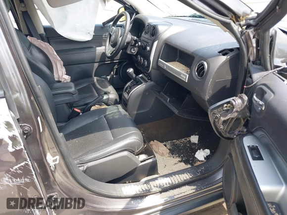 2016 Jeep Compass High Altitude Edition with VIN 1C4NJDEB0GD558230, listed as a IAAI auction lot 39799941 with 57,002 mi miles. Bid and sale history available at carsss.com. Image 5.