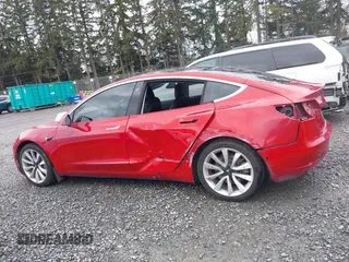 2018 Tesla Model 3 Long Range Battery z VIN 5YJ3E1EB2JF087823, wystawiony jako IAAI lot #41903609 z przebiegiem 69 749 mil mil oraz . Historia ofert i sprzedaży dostępna na DreamBid. Obrazek 15.