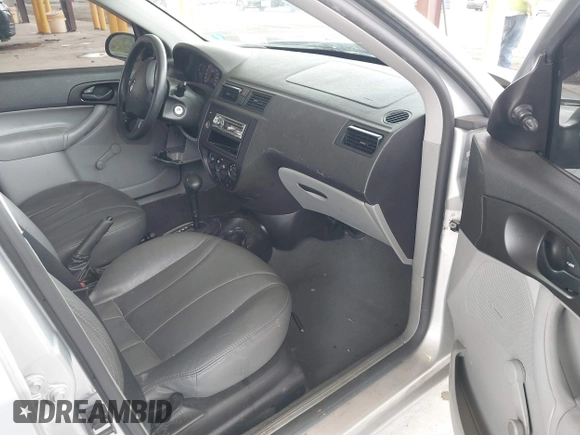 2006 Ford Focus S z VIN 1FAFP34N66W141597, wystawiony jako IAAI lot #42301819 z przebiegiem 94 705 mil mil oraz . Historia ofert i sprzedaży dostępna na DreamBid. Obrazek 5.