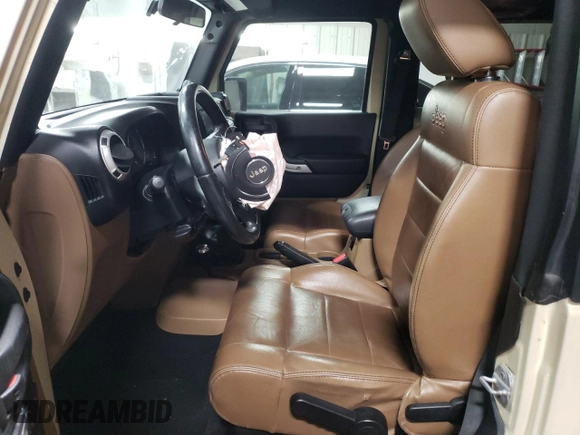 2011 Jeep Wrangler Sahara with VIN 1J4AA5D19BL577347, listed as a Copart auction lot 80340124 with 148,986 mi miles and Salvage Title. Bid and sale history available at DreamBid. Image 7.