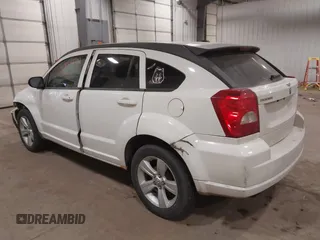 2010 Dodge Caliber SXT with VIN 1B3CB4HA3AD590654, listed as a IAAI auction lot 41814572 with 203,422 mi miles and . Bid and sale history available at DreamBid. Image 3.