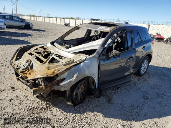 2015 Mazda CX-5 Touring with VIN JM3KE4CYXF0515106, listed as a Copart auction lot 50451185 with 0 mi miles and Salvage Title. Bid and sale history available at carsss.com. Image 1.