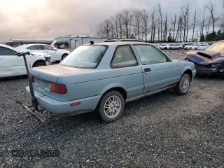 1992 Nissan Sentra E с VIN 1N4EB32A7NC702402, выставлен на аукционе Copart как лот 86629524 с пробегом 233 476 миль миль и Списание • Salvage title. История ставок и продаж доступна на DreamBid. Изображение 3.