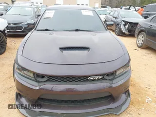 2021 Dodge Charger Scat Pack Widebody with VIN 2C3CDXGJ5MH579324, listed as a IAAI auction lot 41399676 with 77,156 mi miles and . Bid and sale history available at DreamBid. Image 12.