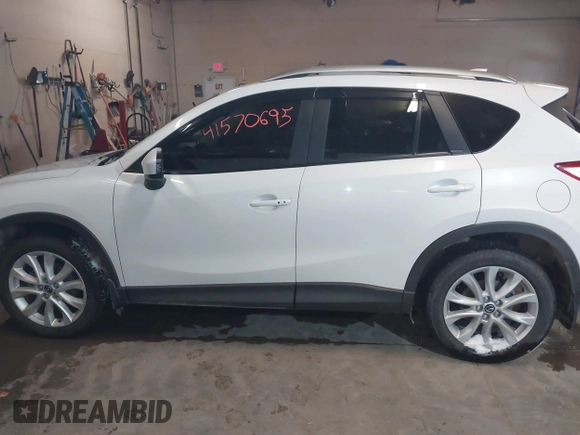 2013 Mazda CX-5 Grand Touring with VIN JM3KE4DE8D0147851, listed as a IAAI auction lot 41570695 with 94,648 mi miles. Bid and sale history available at carsss.com. Image 14.