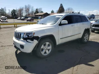2011 Jeep Grand Cherokee Laredo with VIN 1J4RR4GG3BC671780, listed as a Copart auction lot 49179835 with 166,521 mi miles and Salvage Title. Bid and sale history available at carsss.com. Image 1.