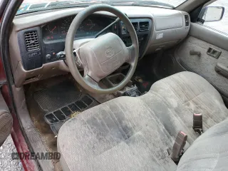 1999 Toyota Tacoma z VIN 4TANL42NXXZ478215, wystawiony jako Copart lot #53201925 z przebiegiem 127 895 mil mil oraz Czysty tytuł • Clean title. Historia ofert i sprzedaży dostępna na DreamBid. Obrazek 8.