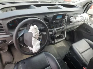 2023 Ford Transit Cargo с VIN 1FTBR2C80PKB31083, выставлен на аукционе Copart как лот 50551005 с пробегом 54 390 миль миль и Списание • Salvage title. История ставок и продаж доступна на DreamBid. Изображение 8.