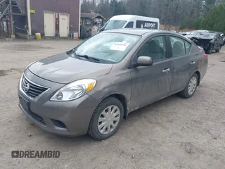 2012 Nissan Versa SV with VIN 3N1CN7AP2CL860205, listed as a IAAI auction lot 42148784 with 185,019 mi miles. Bid and sale history available at carsss.com. Image 2.